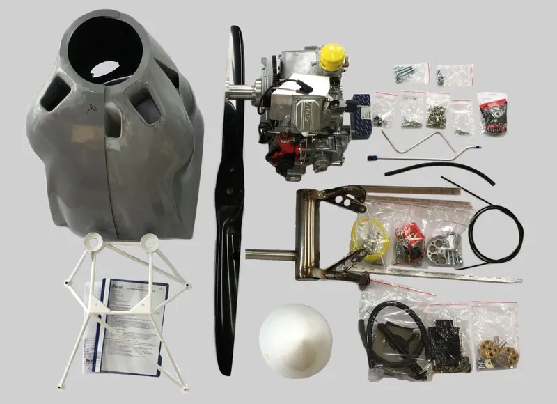 An SE33I XP engine kit laid out: engine, cowl, propeller, mount, spinner and hardware